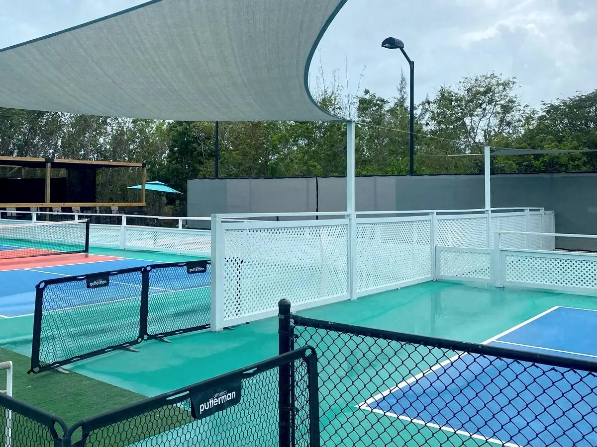 Pickleball courts with shade sails at Racket Club